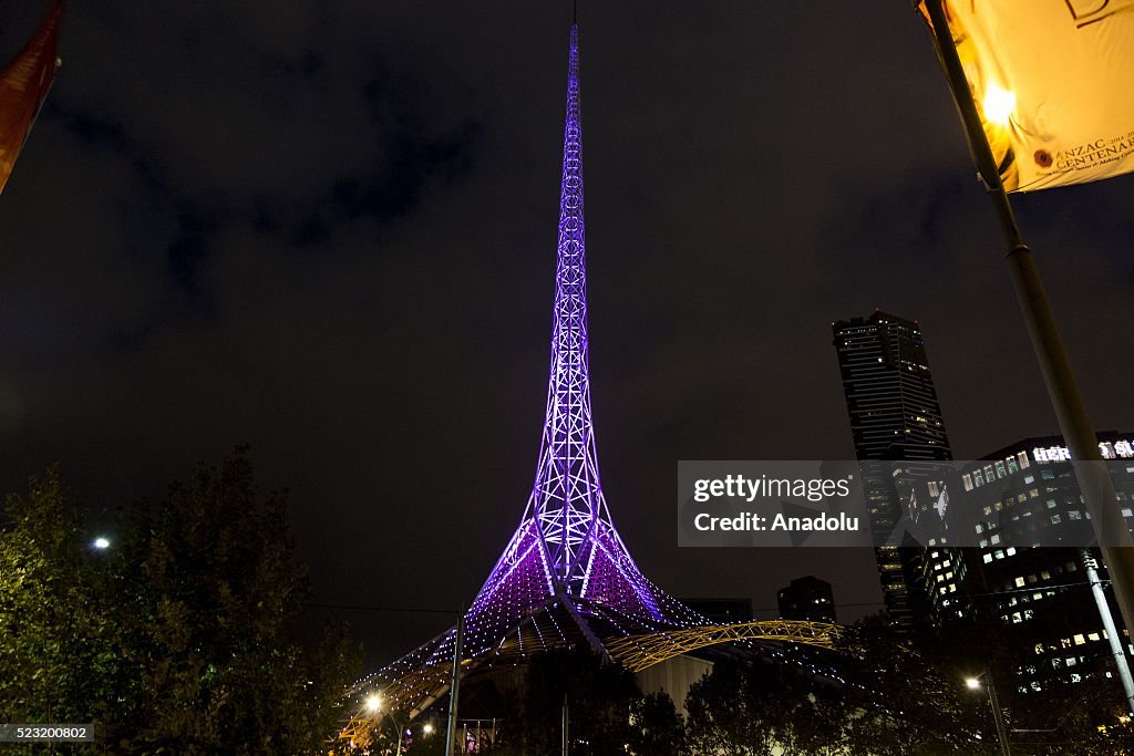 the-melbourne-arts-centre-spire-is-lit-in-purple-in-memory-of-late-picture-id523200802