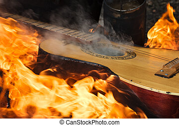 gitarre-in-flammen-auf-lagerfeuer-bild_csp67303072.jpg