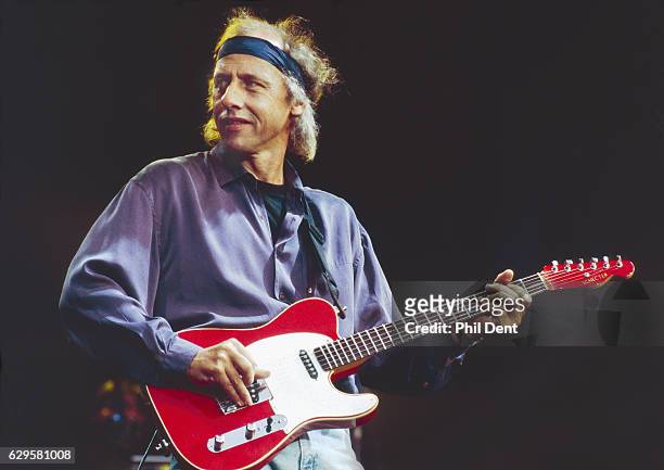 mark-knopfler-of-dire-straits-performs-on-stage-in-birmingham-1991-he-picture-id629581008